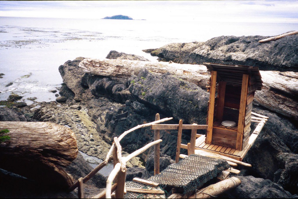 An outhouse with a view, which flushes twice a day. Queen Charlotte Islands in British Columbia Canada.